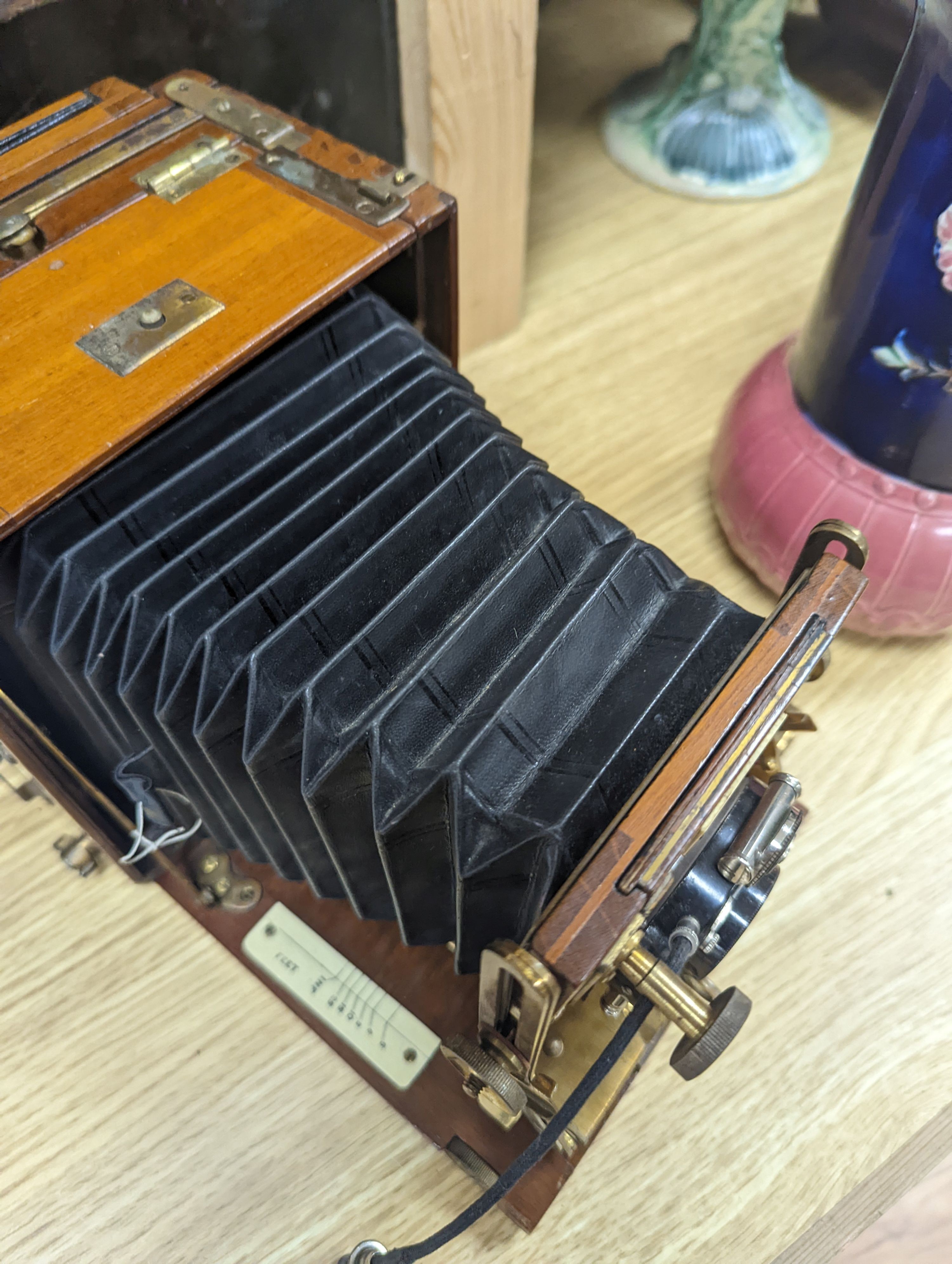 A Sanderson ‘Tropical Model’ plate camera, leather cased with various mahogany plate holders.